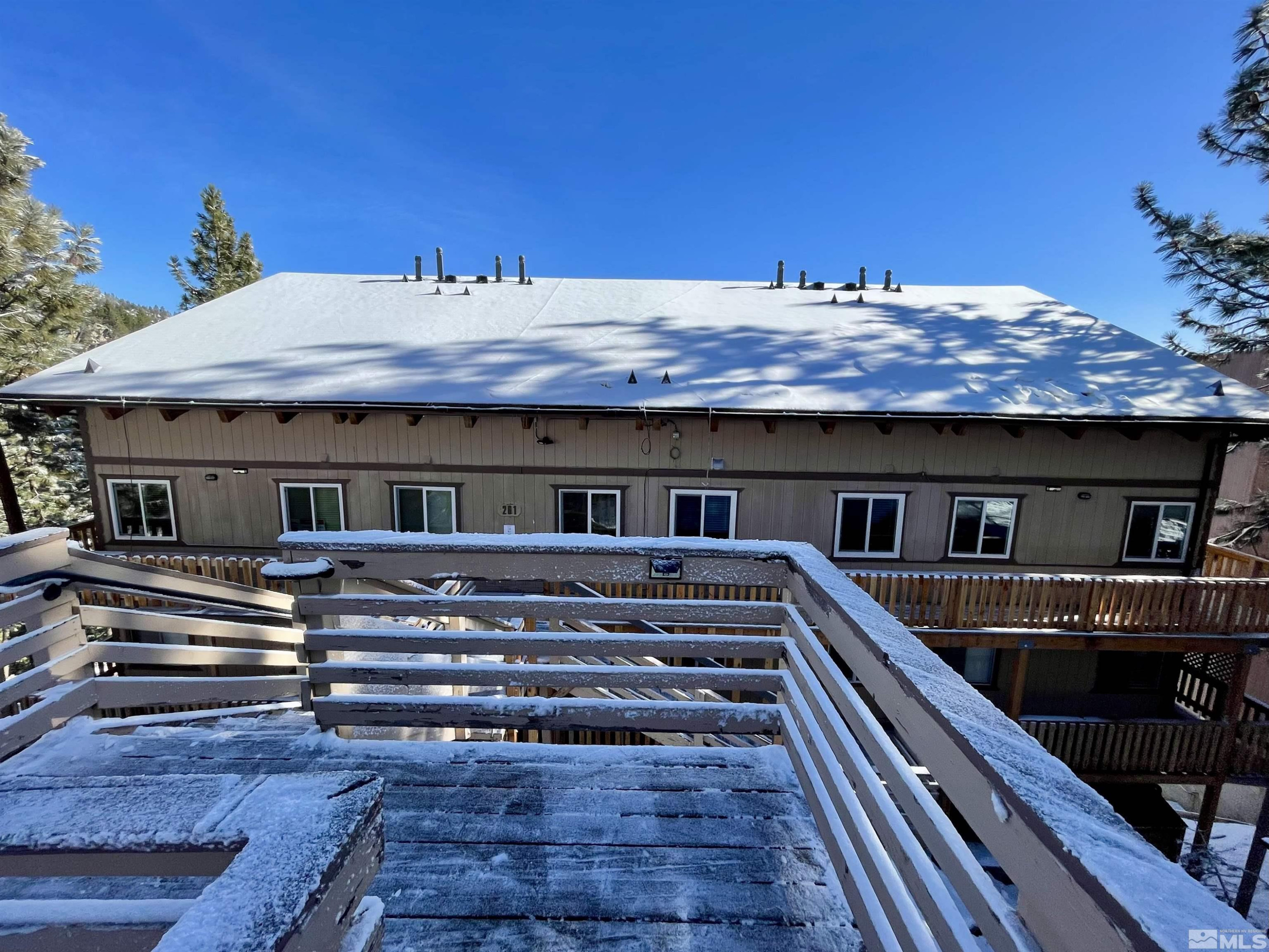 261 Quaking Aspen Lane, Unit B Stateline, NV 89449 - Photo 39 of 40 a view of house with wooden floor and outdoor space
