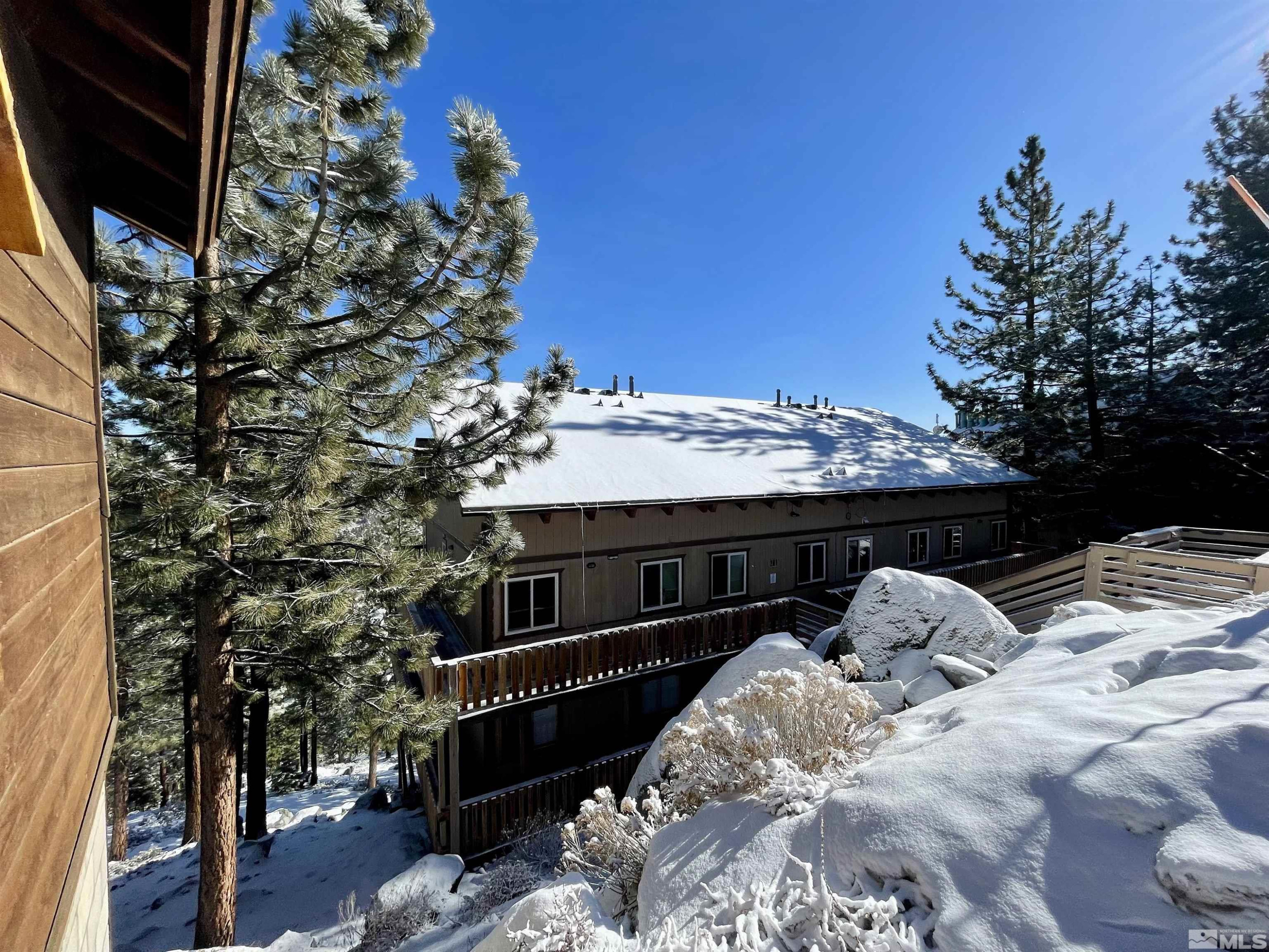 261 Quaking Aspen Lane, Unit B Stateline, NV 89449 - Photo 40 of 40 a view of roof with a tree in the background