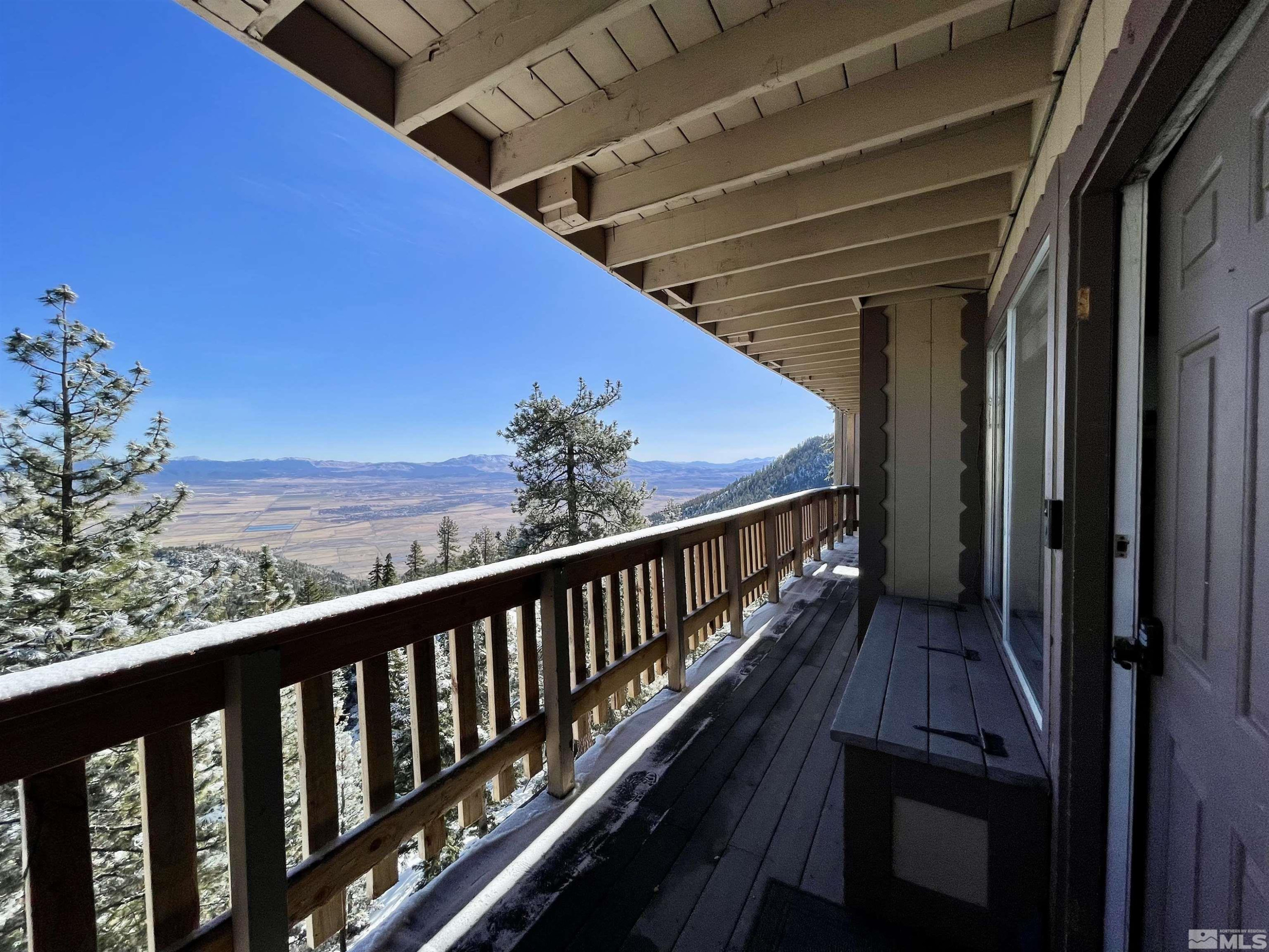 261 Quaking Aspen Lane, Unit B Stateline, NV 89449 - Photo 8 of 40 a view of a balcony with wooden floor