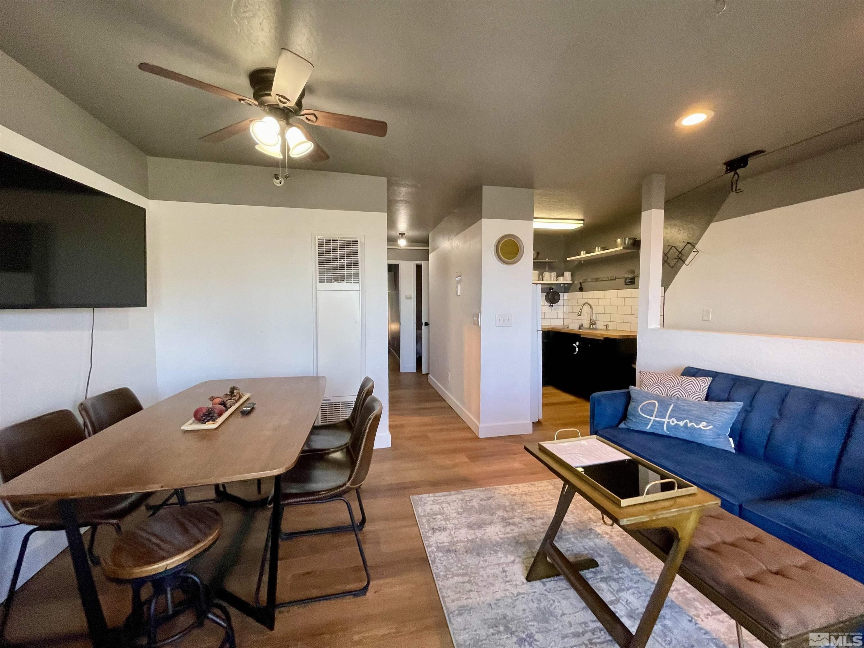261 Quaking Aspen Lane, Unit B Stateline, NV 89449 - Photo 10 of 40 a living room with furniture and a flat screen tv