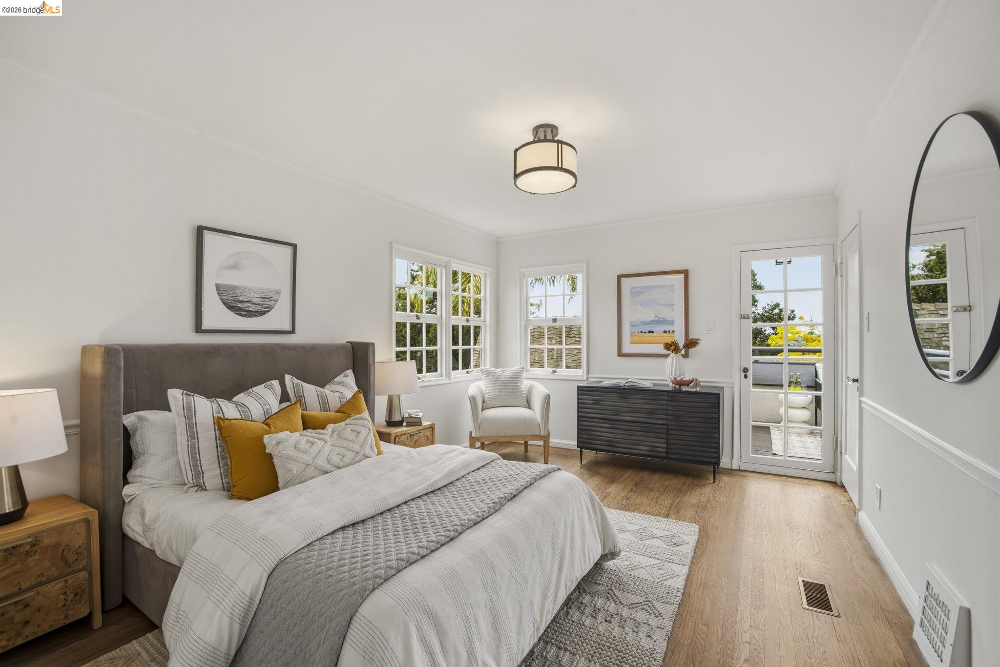 1087 Hubert Road Oakland, CA 94610 - Photo 27 of 67 Hardwood-finish flooring features throughout this bright room