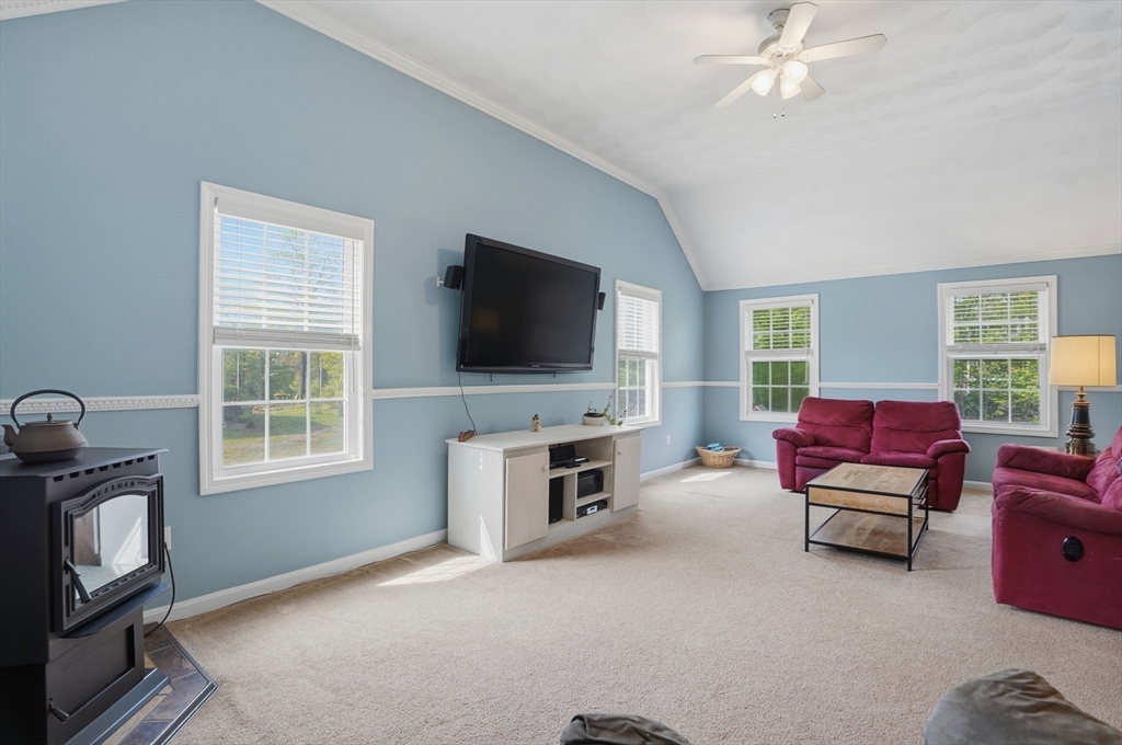 160 Gray Road Templeton, MA 01468 - Photo 10 of 42 a living room with furniture a flat screen tv and a window
