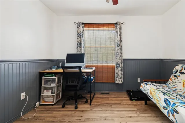 a workspace with furniture and wooden floor