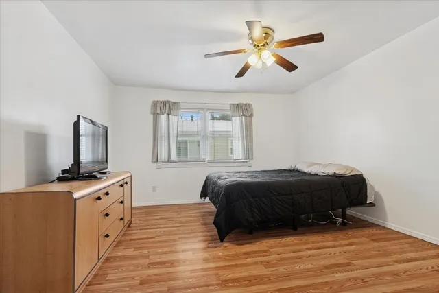 a living room with a bed and furniture