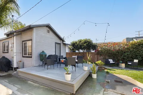 a view of house with outdoor seating area