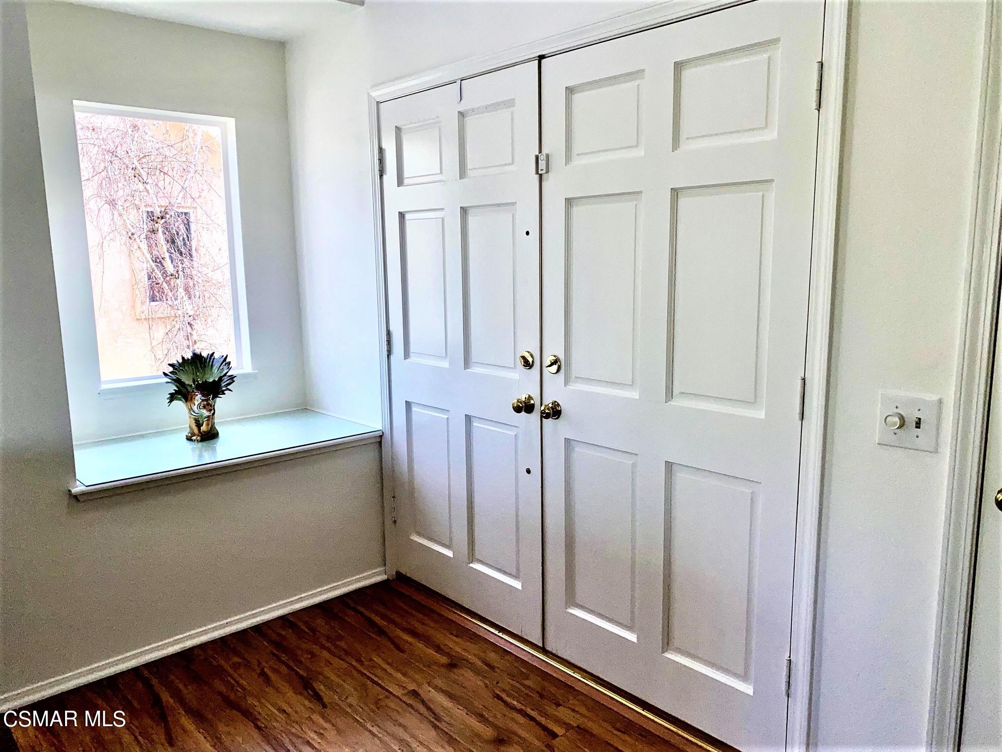 290 Ridgeton Lane, Unit B Simi Valley, CA 93065 - Photo 14 of 25 a view of an entryway with wooden floor