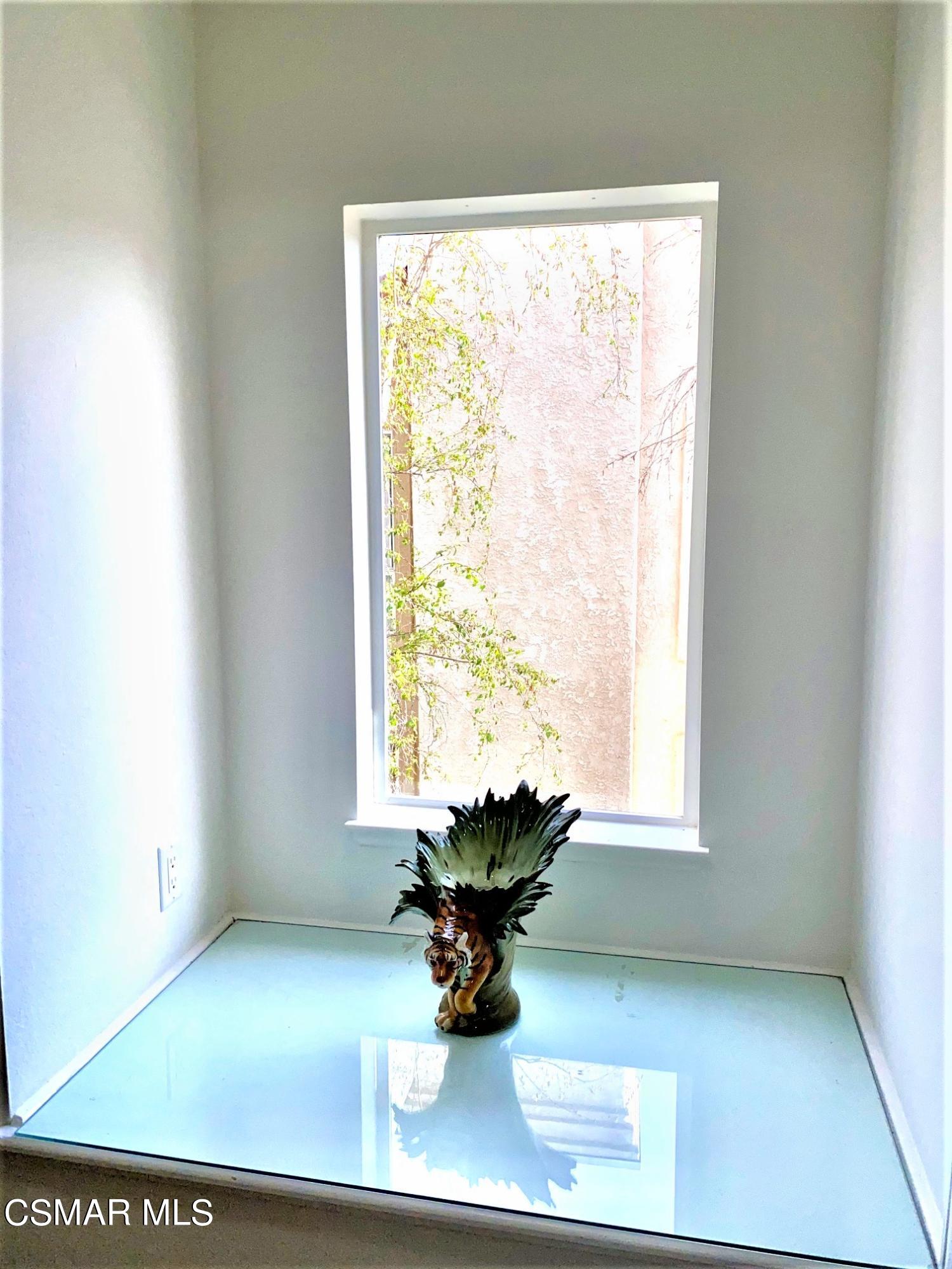 290 Ridgeton Lane, Unit B Simi Valley, CA 93065 - Photo 15 of 25 a view of a living room with a window and a table