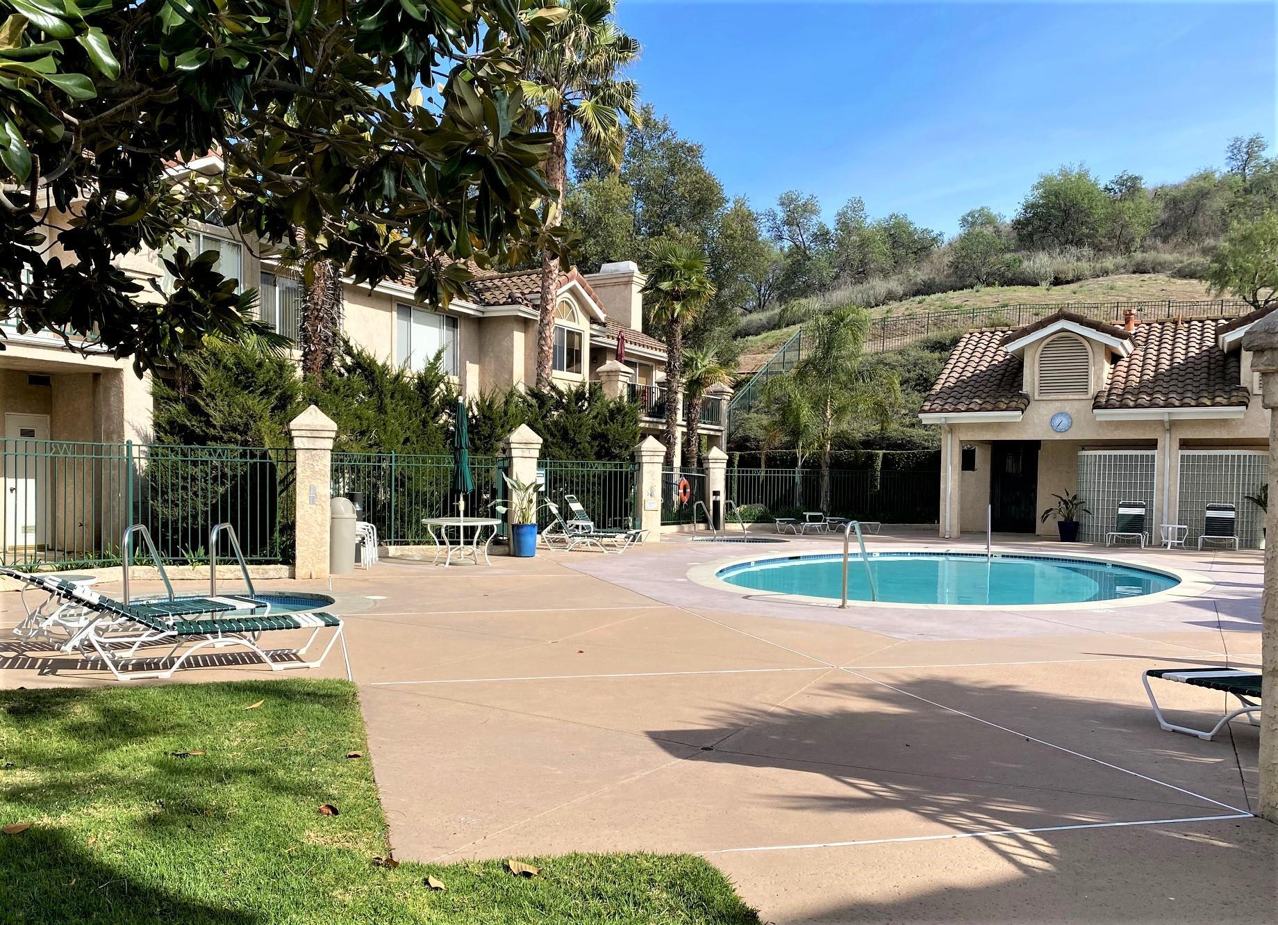 290 Ridgeton Lane, Unit B Simi Valley, CA 93065 - Photo 24 of 25 a front view of a house with a yard