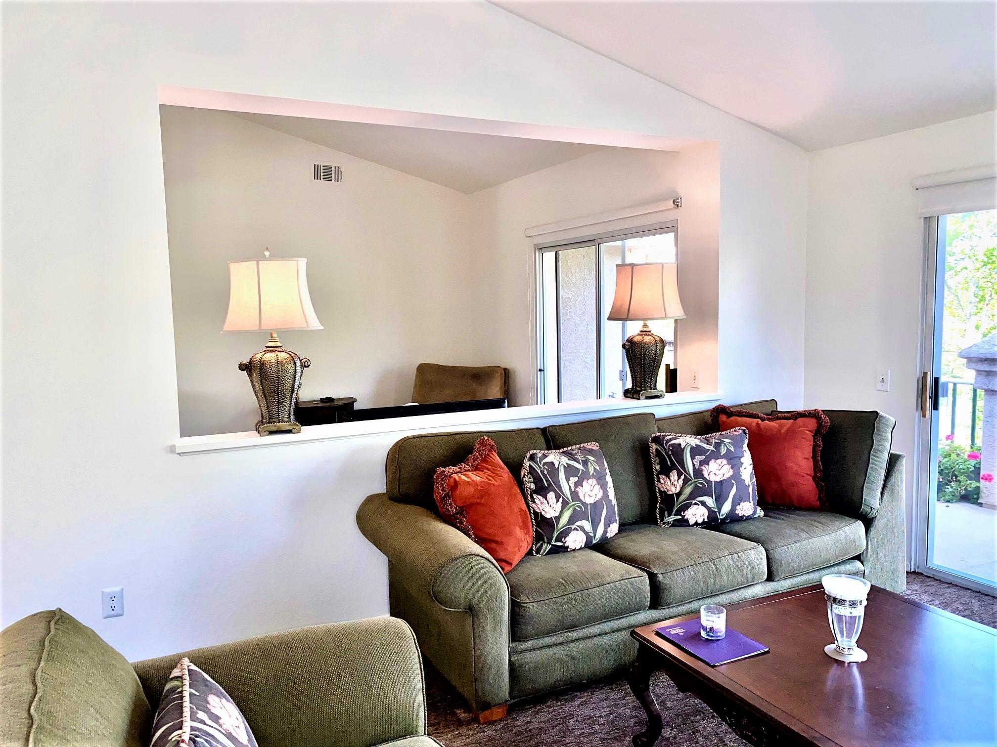 290 Ridgeton Lane, Unit B Simi Valley, CA 93065 - Photo 7 of 25 a living room with furniture and a large window