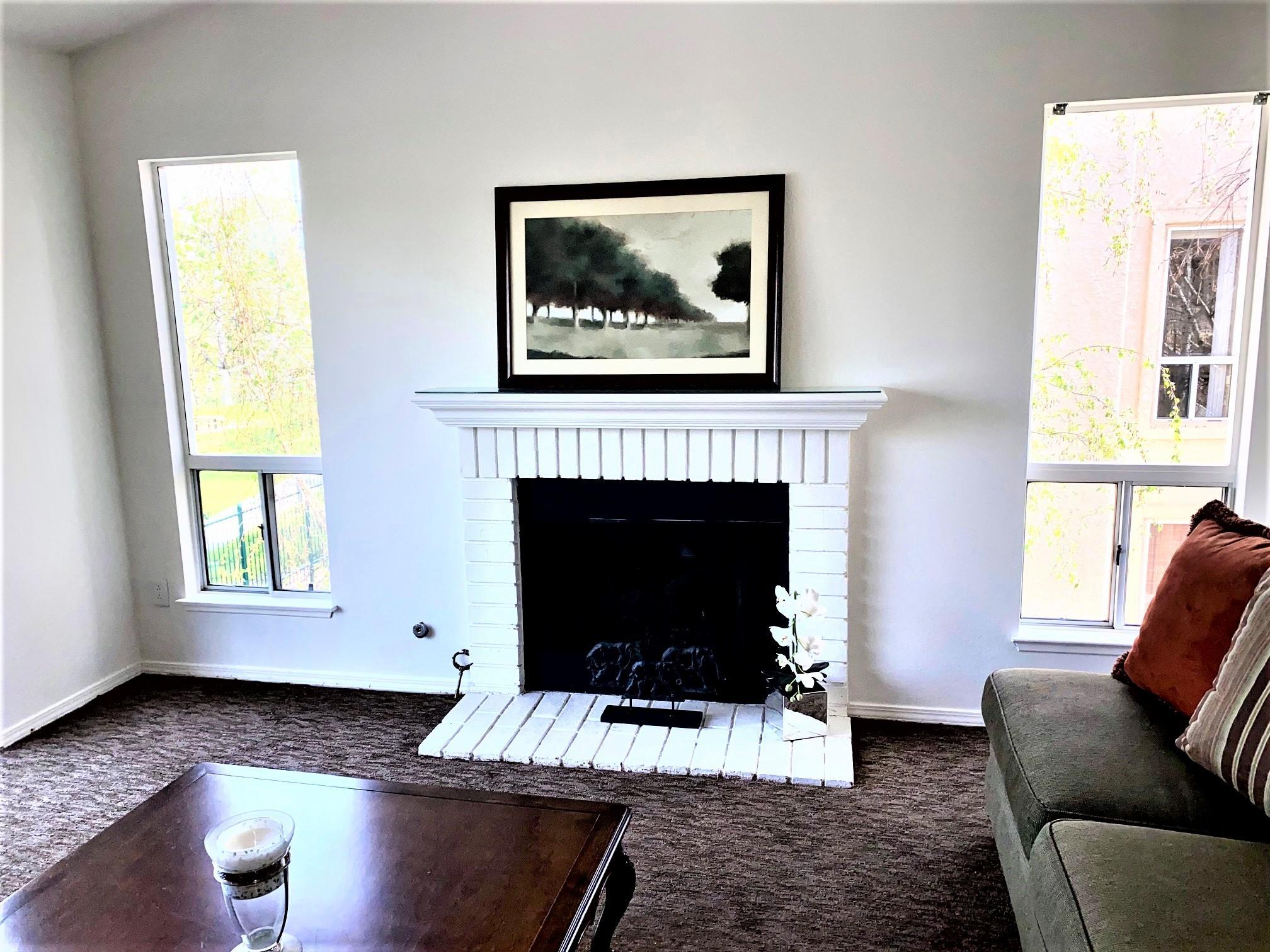 290 Ridgeton Lane, Unit B Simi Valley, CA 93065 - Photo 8 of 25 a living room with furniture and a fireplace