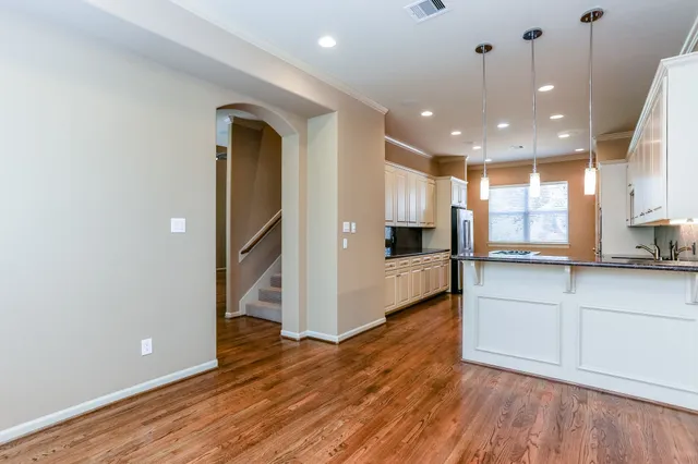 a view of kitchen with cabinets and wooden floor