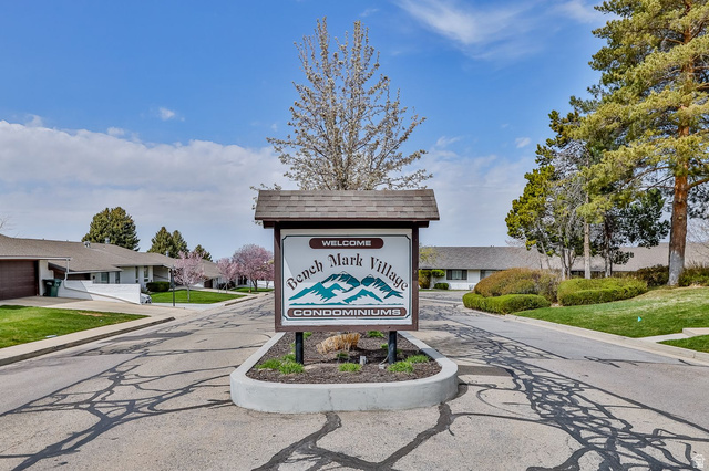 34 Benchmark Village Tooele, UT 84074 - Photo 3 of 35 Community / neighborhood sign with a lawn
