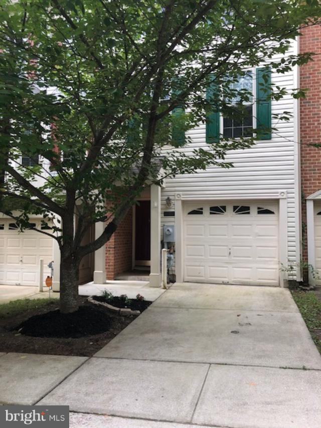 27 Bank Spring Court Owings Mills, MD 21117 - Photo 1 of 27 a view of a white house with a large tree