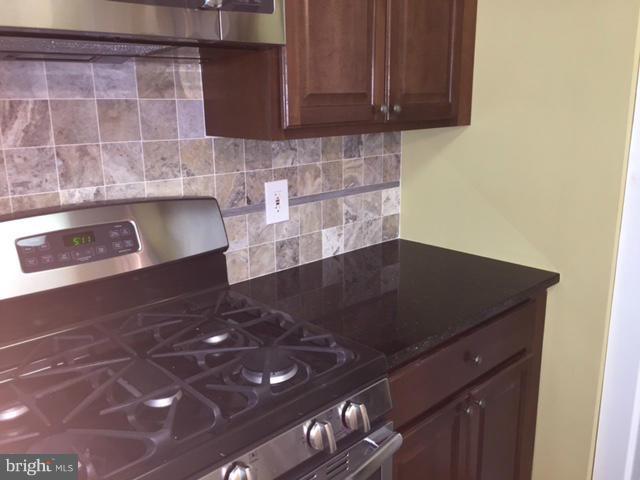 27 Bank Spring Court Owings Mills, MD 21117 - Photo 14 of 27 a view of cabinets and wooden floor