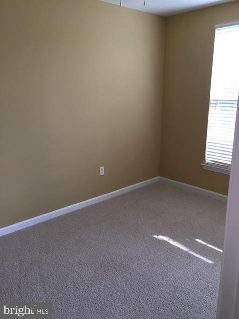 27 Bank Spring Court Owings Mills, MD 21117 - Photo 16 of 27 a view of an empty room with a window