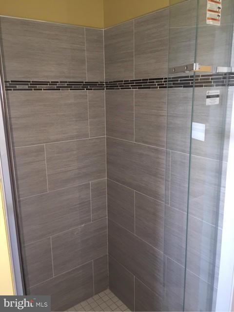 27 Bank Spring Court Owings Mills, MD 21117 - Photo 18 of 27 a bathroom with a shower