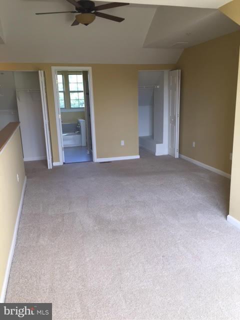 27 Bank Spring Court Owings Mills, MD 21117 - Photo 19 of 27 an empty room with a fireplace and windows
