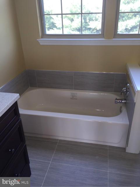 27 Bank Spring Court Owings Mills, MD 21117 - Photo 22 of 27 a white bath tub sitting next to a window