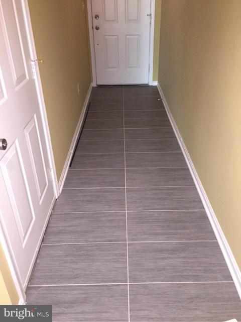 27 Bank Spring Court Owings Mills, MD 21117 - Photo 3 of 27 a view of a hallway with wooden floor and staircase