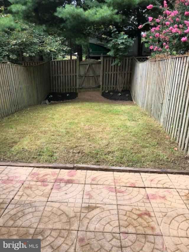 27 Bank Spring Court Owings Mills, MD 21117 - Photo 5 of 27 a view of backyard with wooden fence