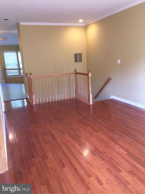 27 Bank Spring Court Owings Mills, MD 21117 - Photo 8 of 27 a view of a hallway with wooden floor