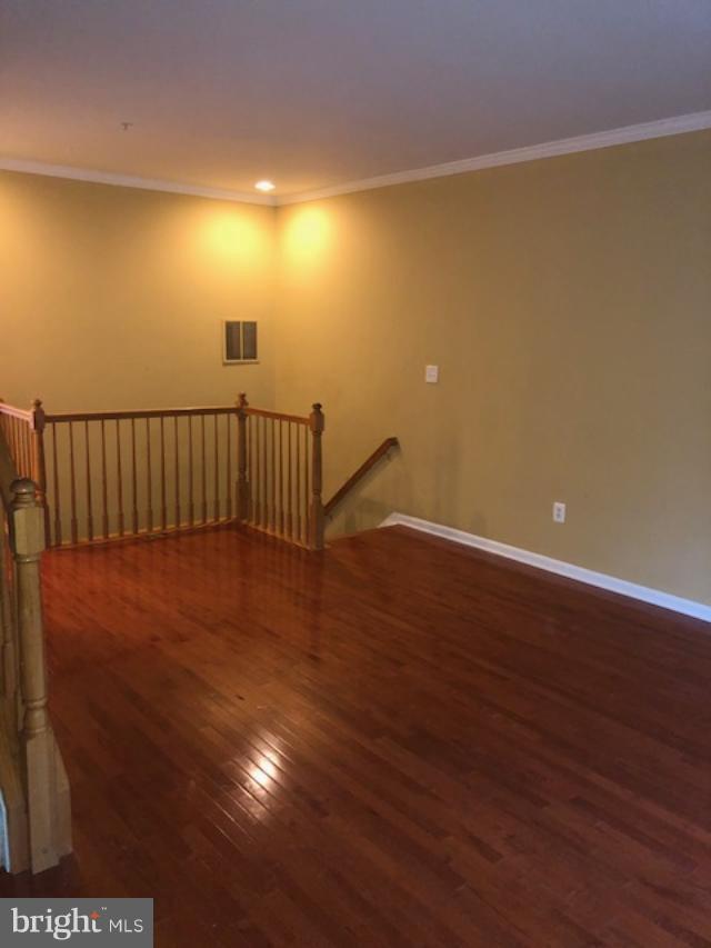 27 Bank Spring Court Owings Mills, MD 21117 - Photo 9 of 27 a view of hallway with wooden floor