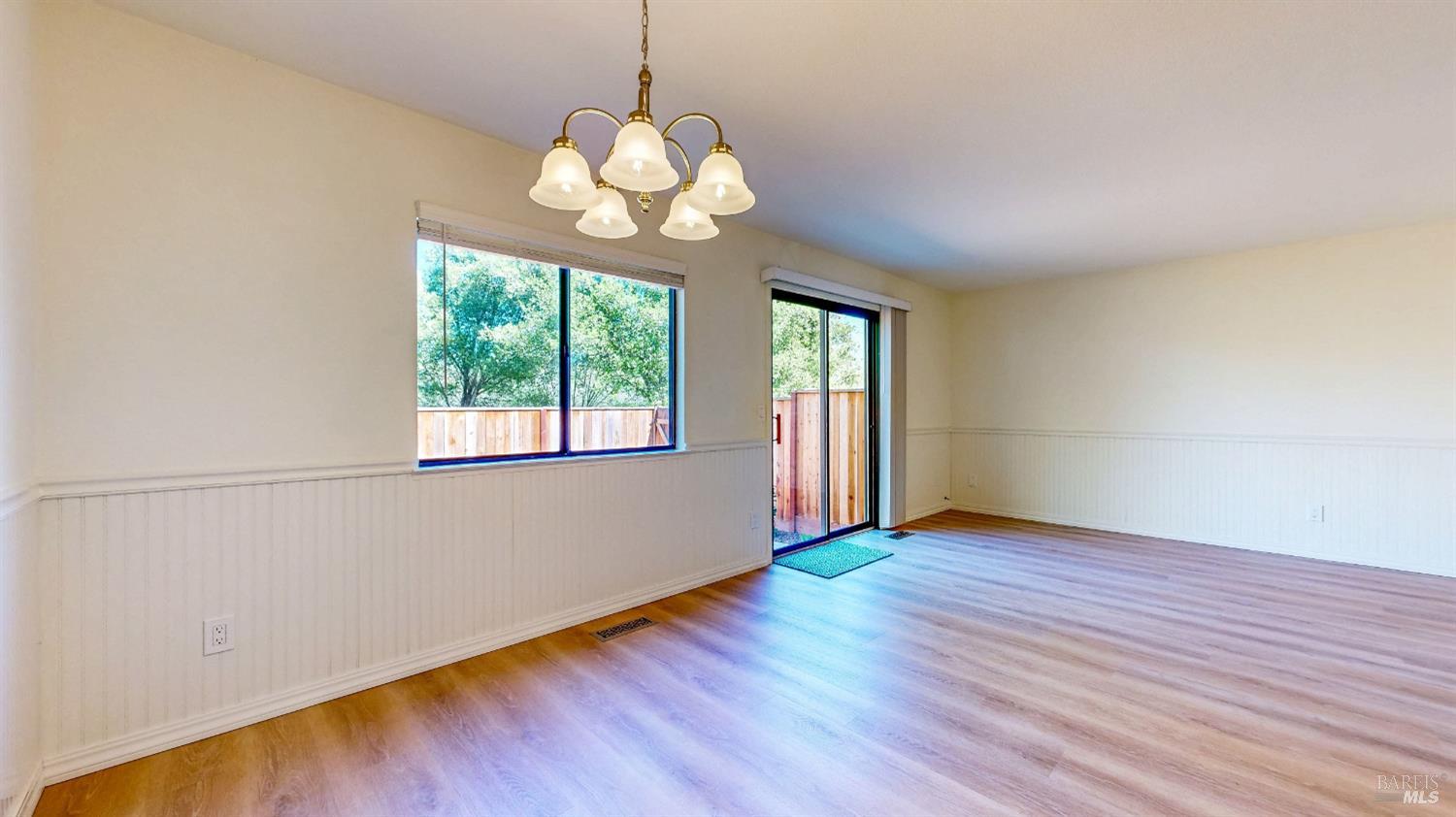 158 North Dutton Avenue Santa Rosa, CA 95401 - Photo 13 of 50 a view of an empty room with wooden floor and a window