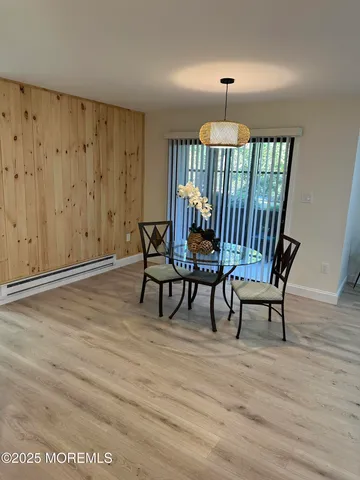 a workspace room with furniture and wooden floor