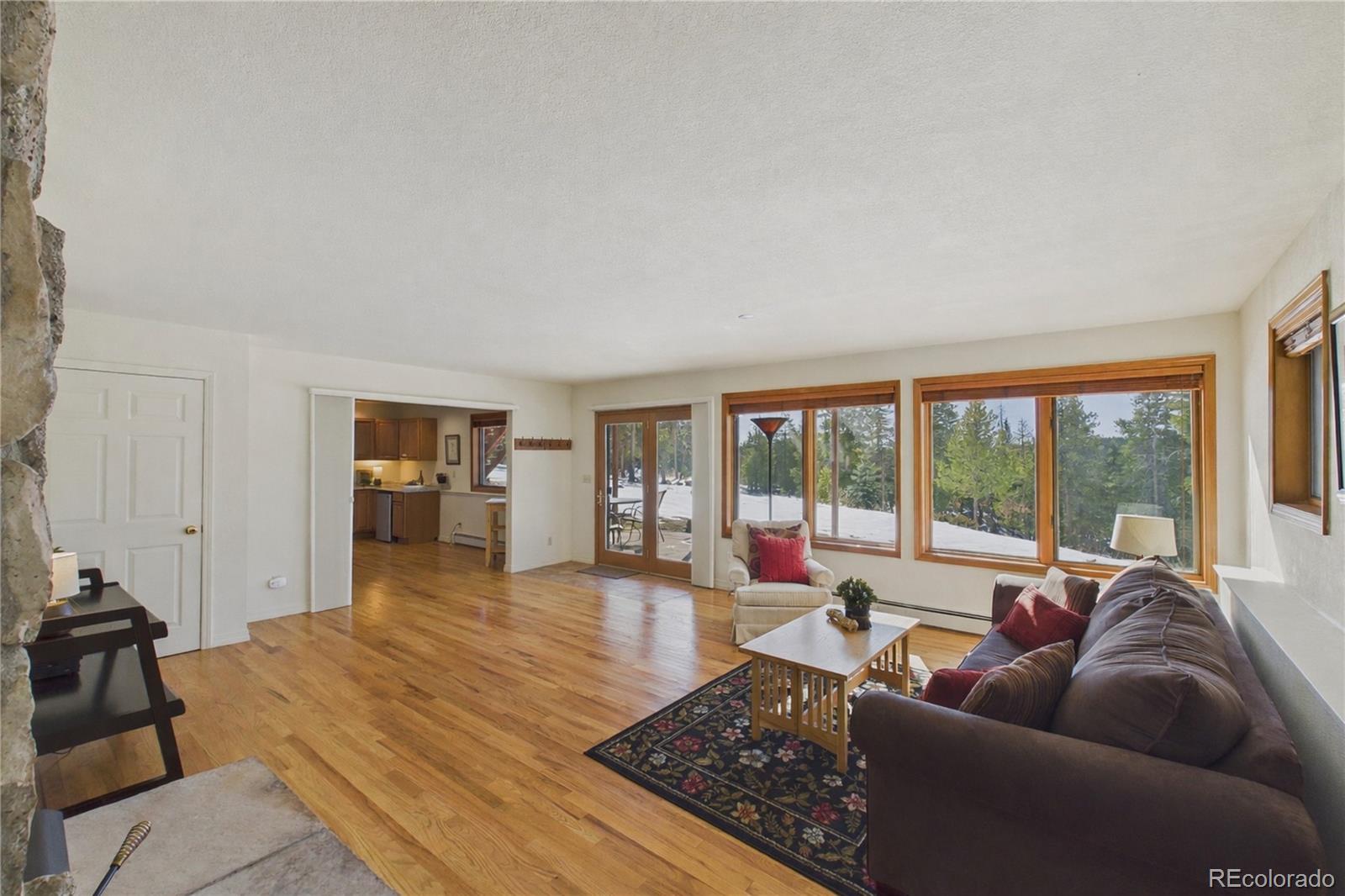 10798 Crystal Way Morrison, CO 80465 - Photo 24 of 36 a living room with furniture and a large window