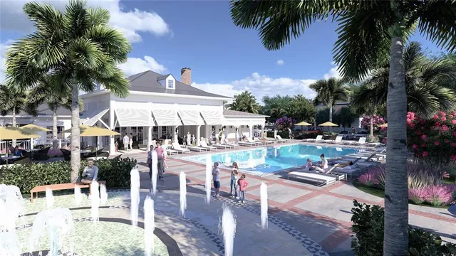 a view of a swimming pool with outdoor seating and a patio