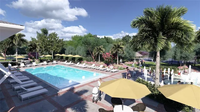 a view of a swimming pool with a table and chairs
