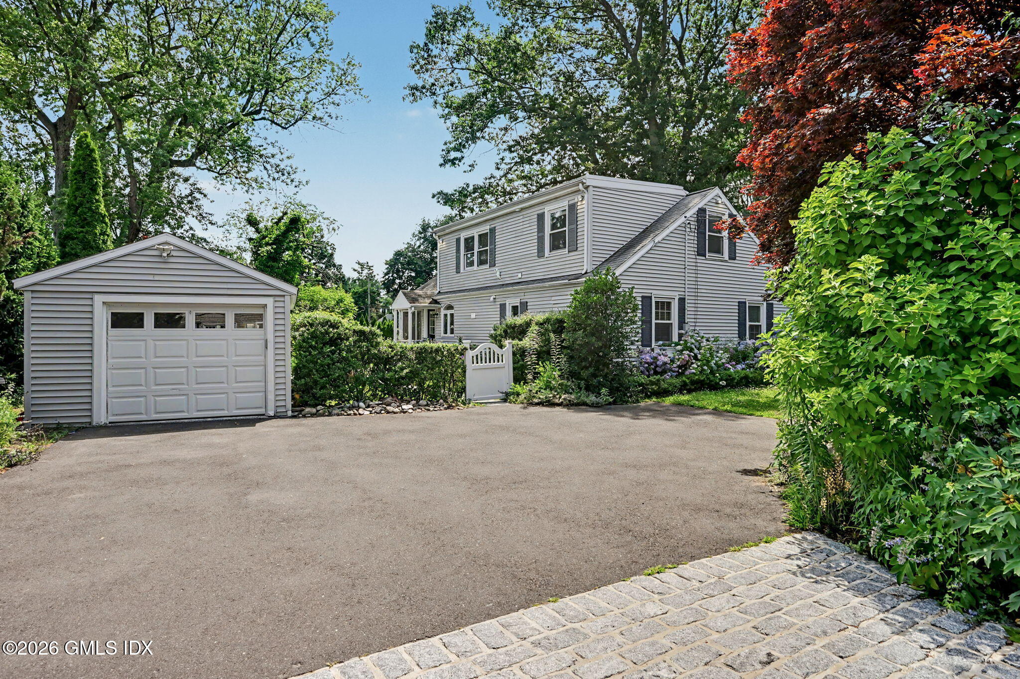 124 Shore Road Old Greenwich, CT 06870 - Photo 24 of 28 a view of a house with a yard