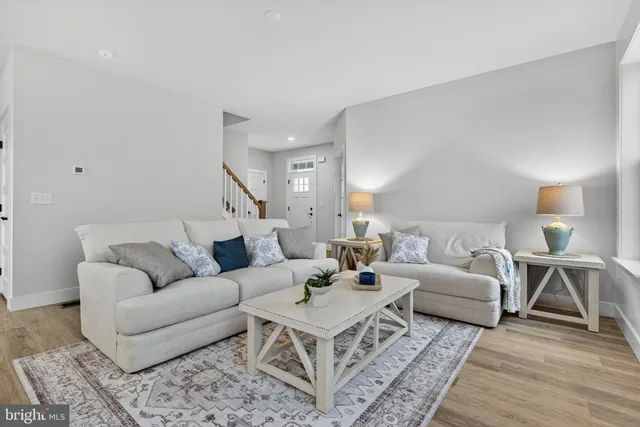 a living room with furniture and a rug