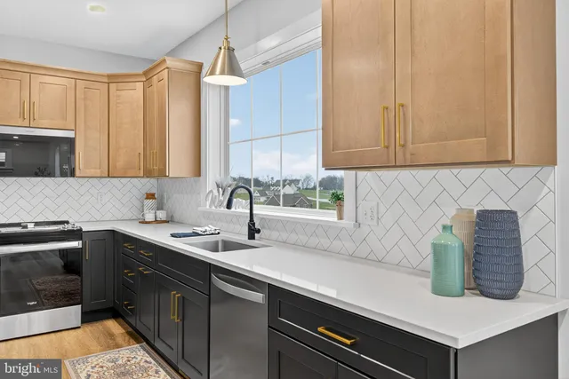 a kitchen with a sink and cabinets
