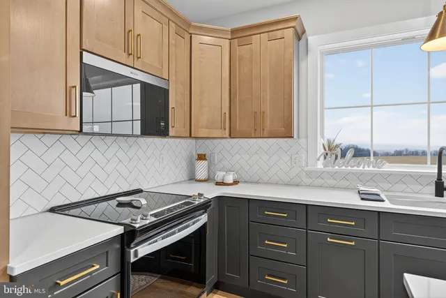a kitchen with a sink stove and cabinets