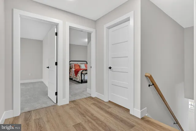 a bed room with furniture and mirror