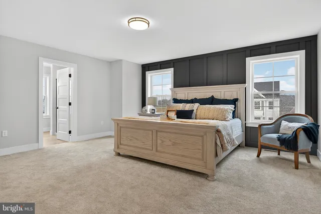 a bedroom with a bed and cabinets