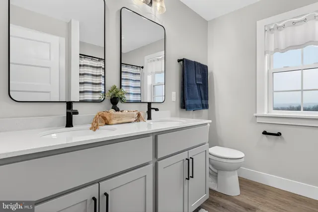 a view of a house with swimming pool and sitting area