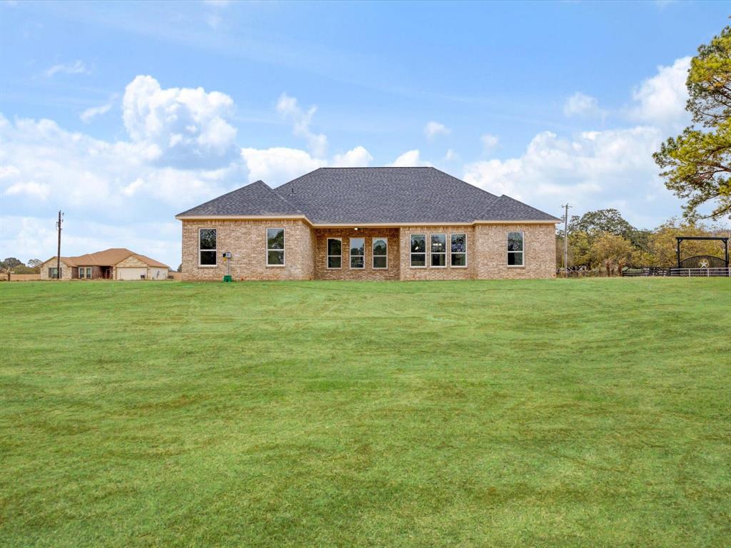 544 Shepherd Road Combine, TX 75159 - Photo 15 of 36 Back of property with a yard, a shingled roof, and brick siding
