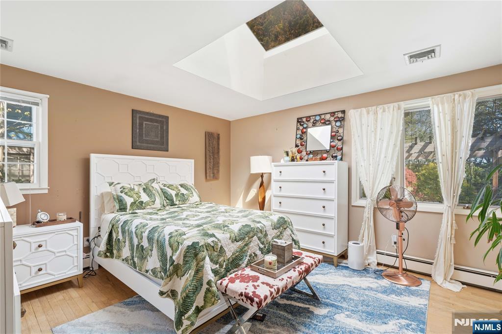 1675 Broad Street Bloomfield, NJ 07003 - Photo 10 of 35 a bedroom with a bed and a furniture