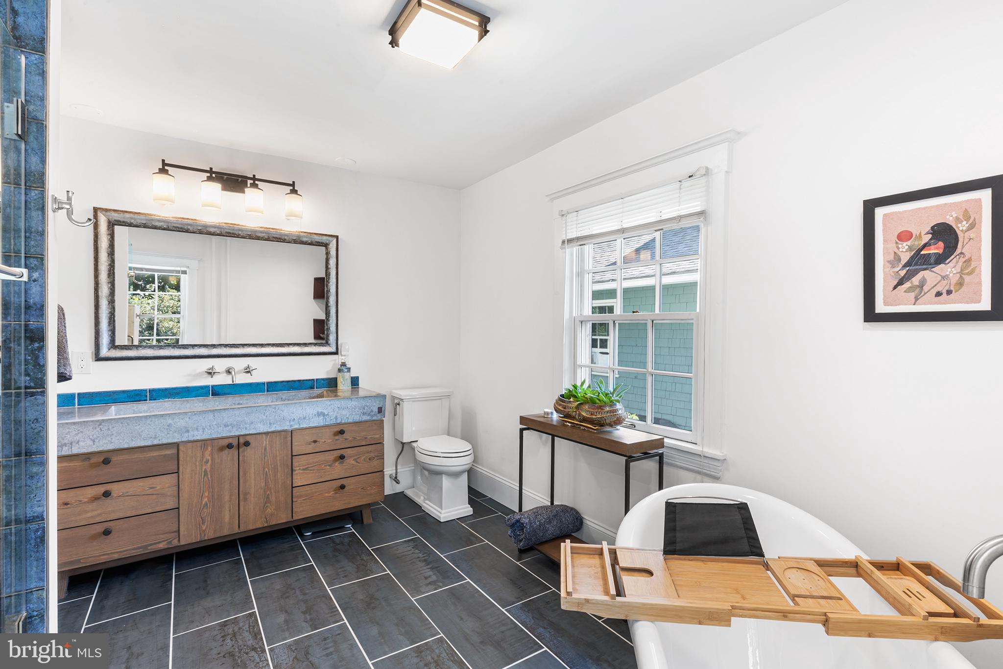 114 Simpson Road Ardmore, PA 19003 - Photo 21 of 37 a spacious bathroom with a toilet a sink and mirror
