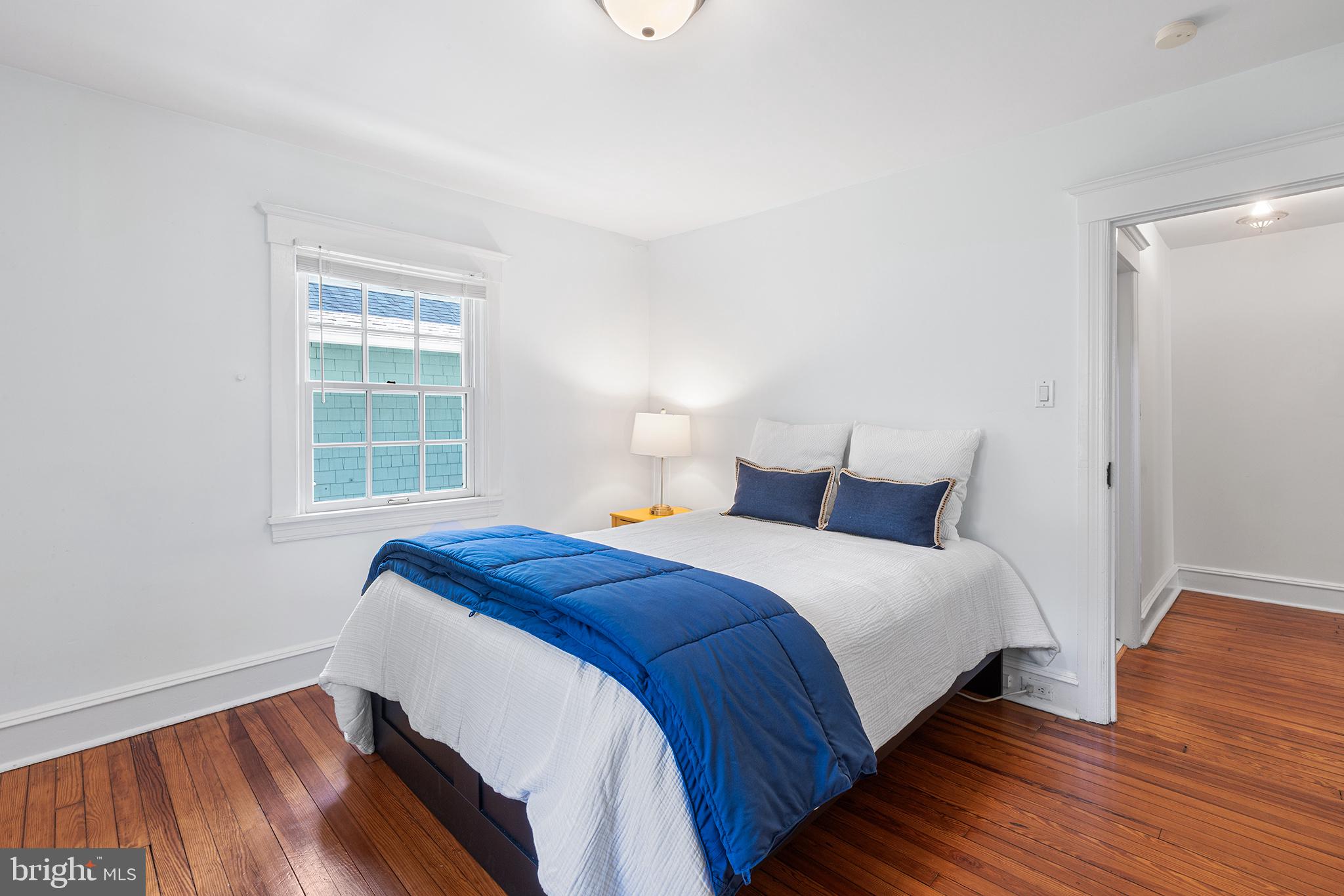 114 Simpson Road Ardmore, PA 19003 - Photo 23 of 37 a bedroom with a bed and wooden floor