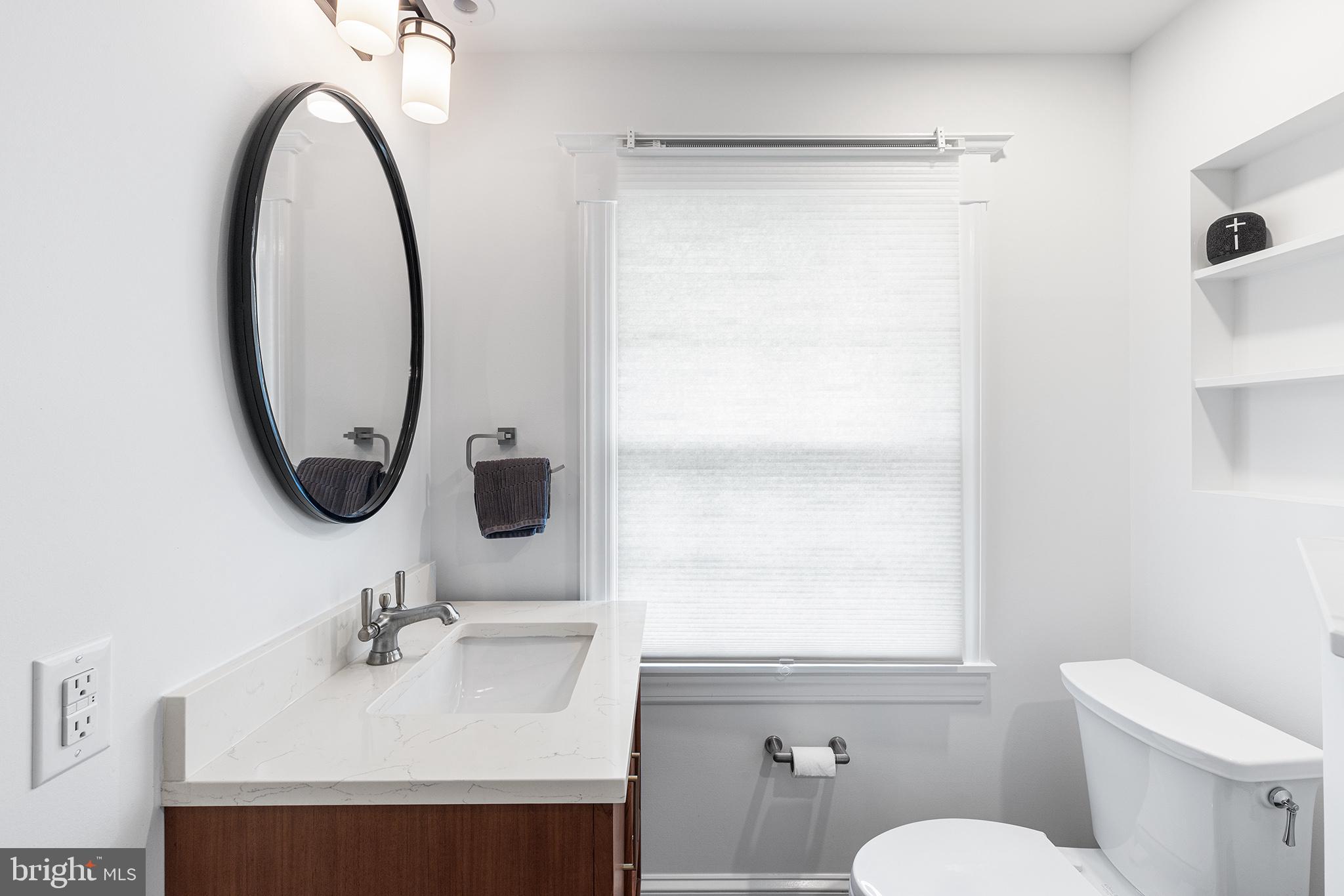 114 Simpson Road Ardmore, PA 19003 - Photo 25 of 37 a bathroom with a sink a toilet and a mirror