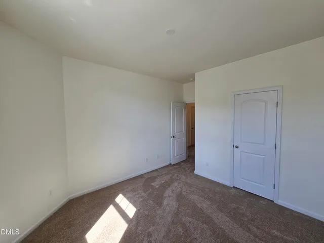 wooden floor and closet in a en suite bathroom