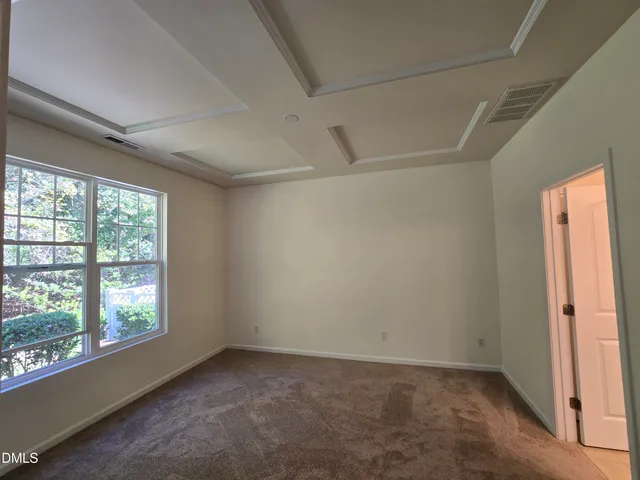 a bathroom with a double vanity sink and a toilet