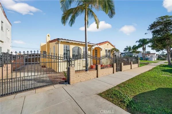 a view of a house with a swimming pool and a porch