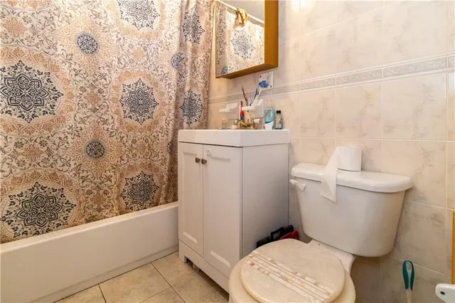 a bedroom with a bed and a chair