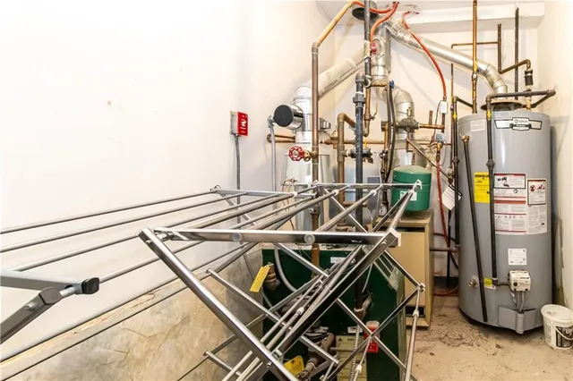 a utility room with a sink dryer and washer