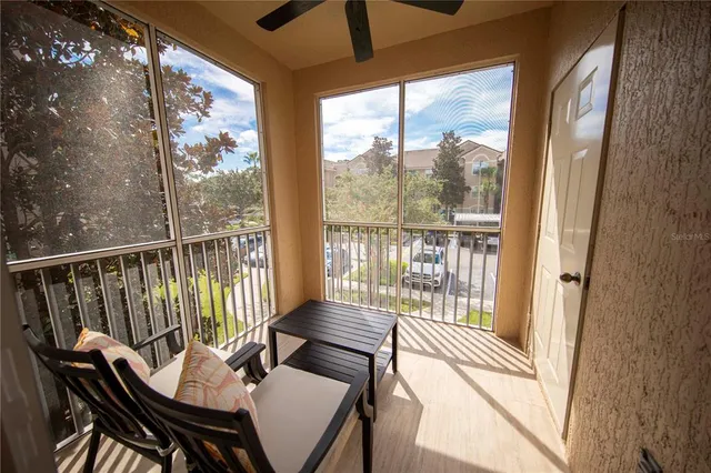 a view of a balcony with wooden floor