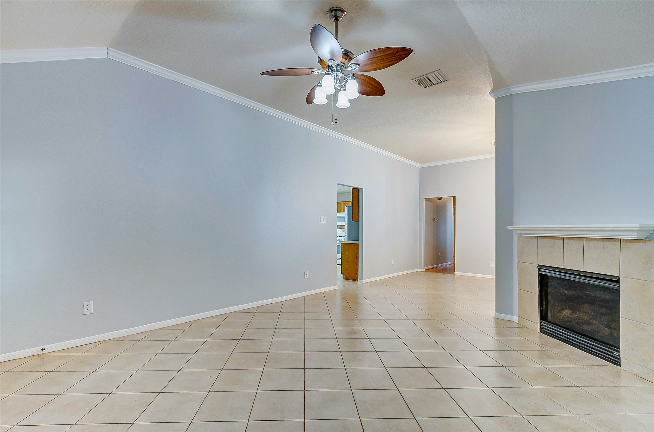 3238 Clipper Winds Way Houston, TX 77084 - Photo 3 of 21 The living room has a cozy fireplace.